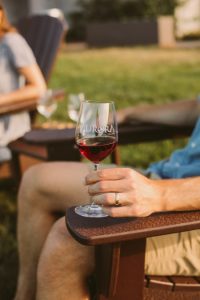 Man drinking a glass of wine at Aurora Cellars in Lake Leelanau